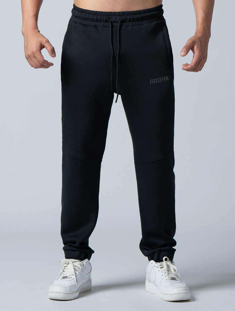 AirFlex™ loose-fitting cuffed trousers (black)